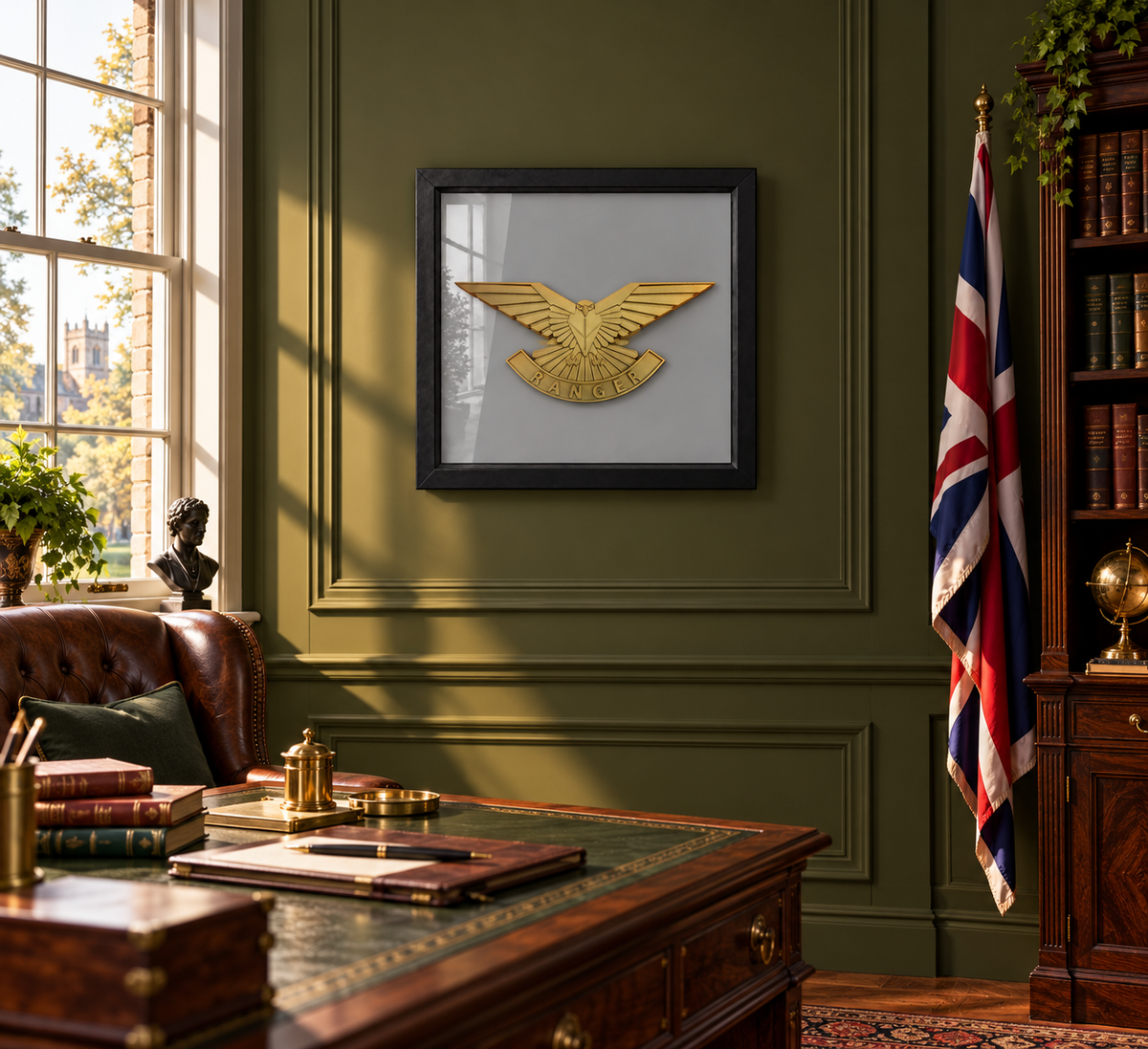 Black-framed Ranger Regiment cap badge display above a desk in a traditional British study with olive-green walls