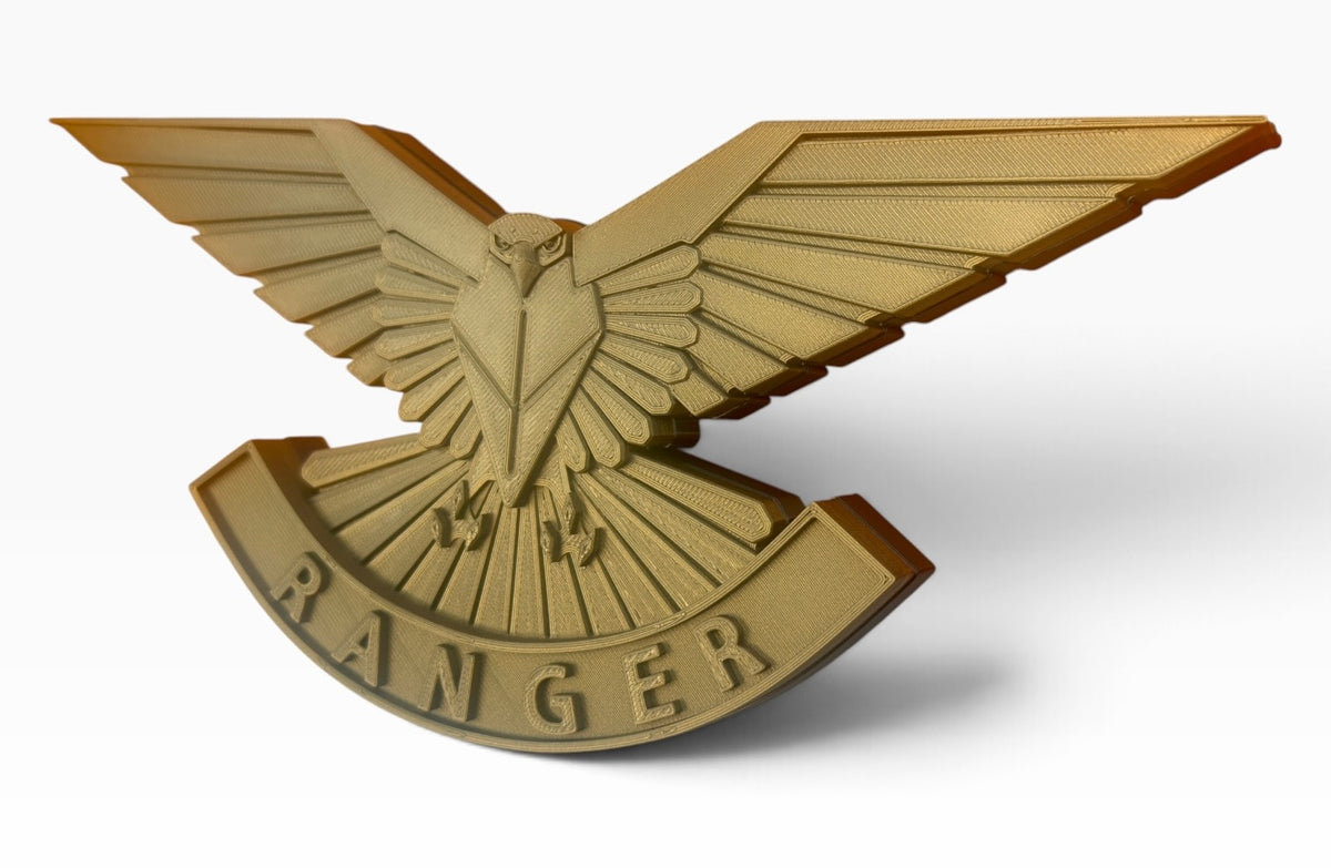 Three-quarter view of the Ranger Regiment cap badge wall display showing raised feather detail and scroll lettering