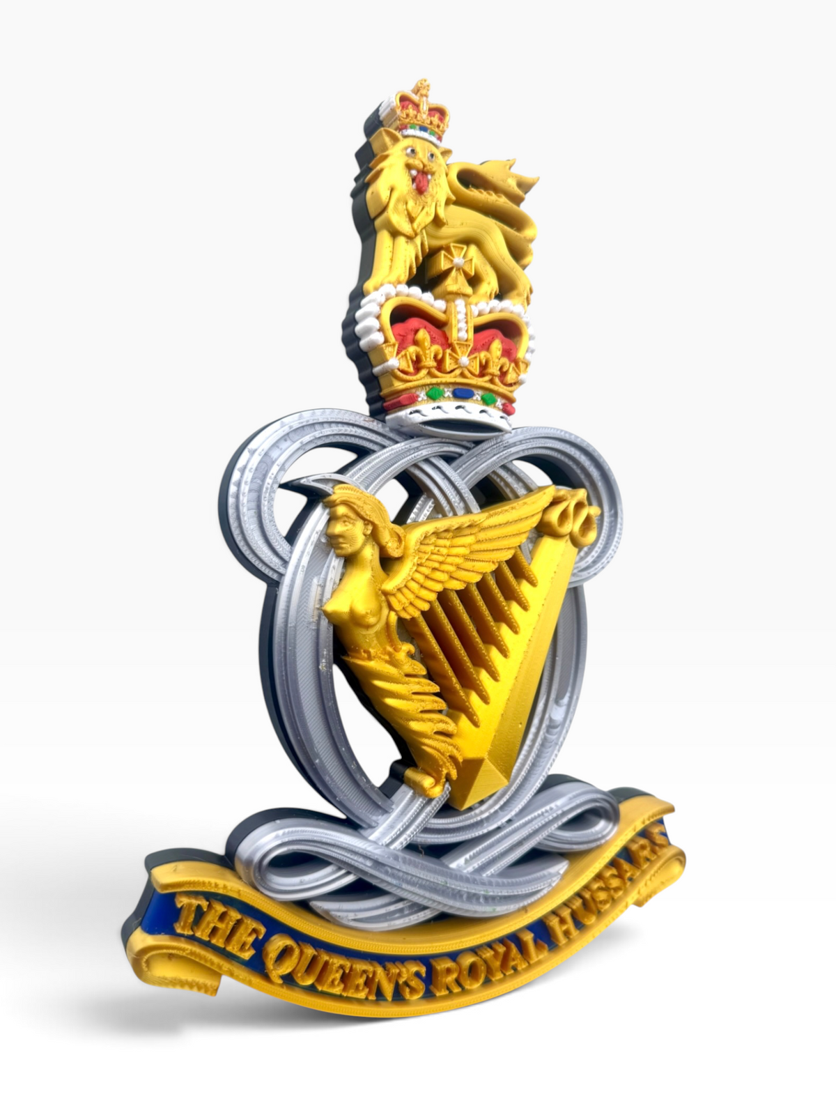 Detailed Queen’s Royal Hussars Queen’s Crown cap badge with the coloured regimental scroll