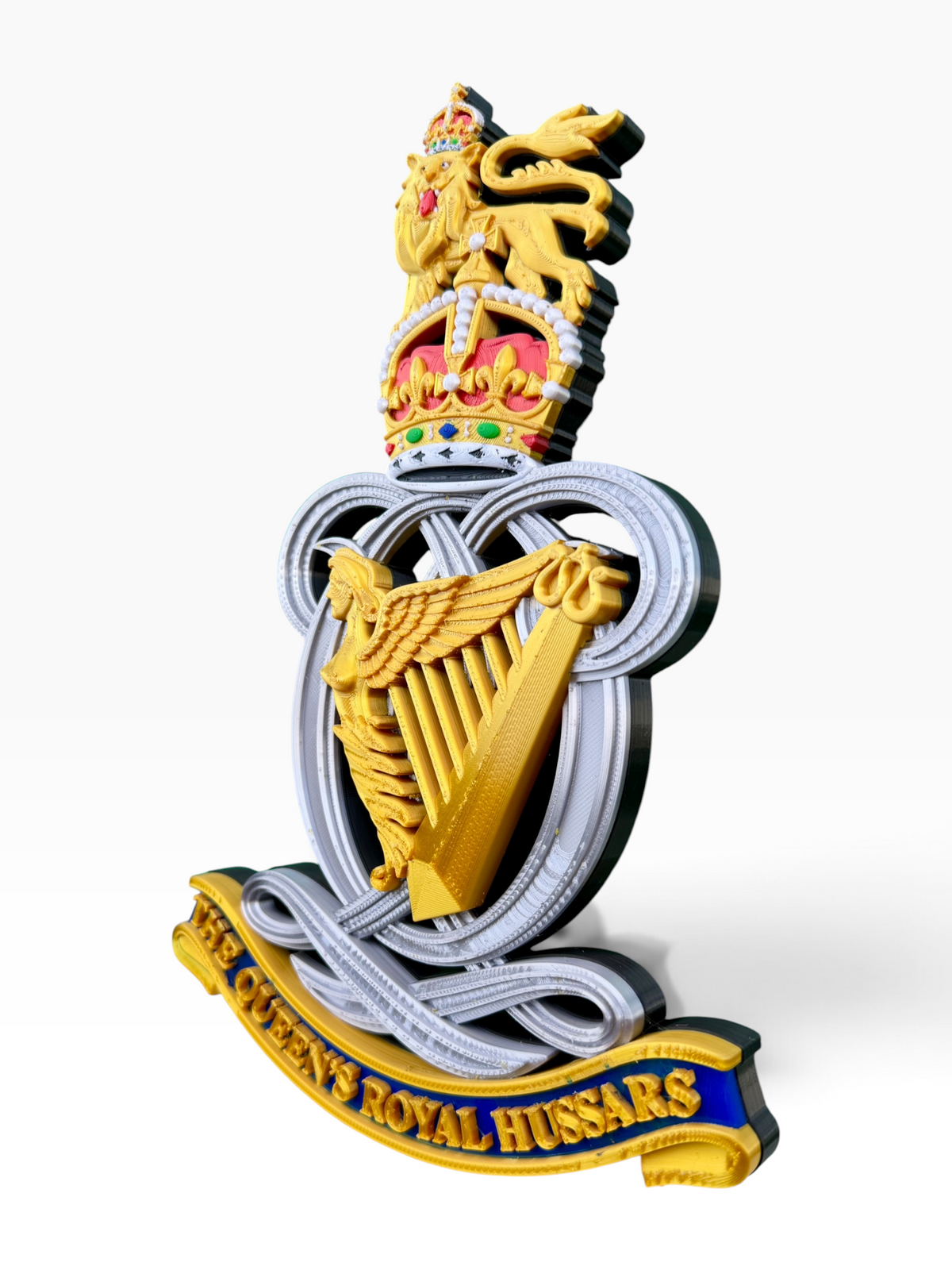 Close-up detail of the Queen’s Royal Hussars King’s Crown cap badge
