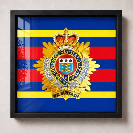 Royal Logistic Corps Queen's Crown cap badge in a black display frame with blue, red and yellow striped backing